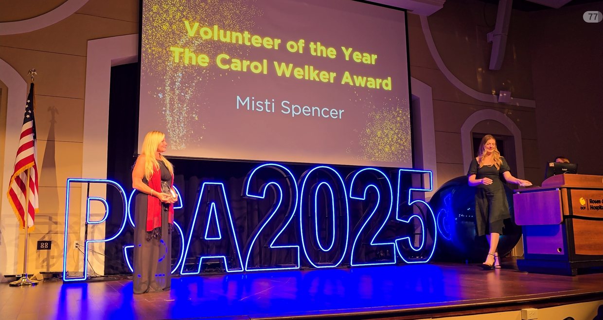 Misti Spencer receiving the Volunteer of the Year, Carol Welker Award at PSA 2025